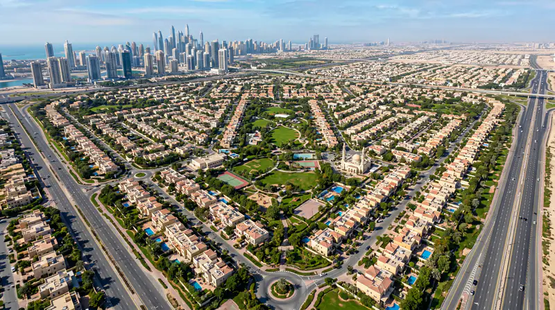 AC repair technician servicing air conditioning in JVT Dubai